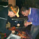 Preparing to cut up the cooked pig.