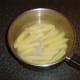 Parboil the chipped potatoes in water