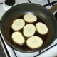 Pan frying the potato slices