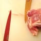 Pulling tendon away from muscle.