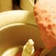 Pour the raspberry mixture into the ice cream maker.
