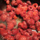 Defrost the frozen raspberries, then add the sugar and the cream.