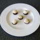 Sit the scallops carefully on top of the slices of black pudding