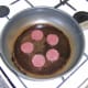 Gently fry the black pudding slices