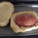 With a sharp knife cut off a lid. Carve ham and close lid immediately to keep ham warm until served.