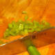 Finely chop celery
