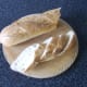 Slice the French stick at a forty-five degree angle for bigger, more shapely wedges