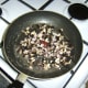 Mushrooms, garlic and calamari offcuts are fried in butter