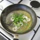Calamari rings are fried in butter, lemon juice and parsley