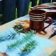 After dipping sprigs in a hot cup of thyme-flavored water, the rosemary is sprinkled with sugar and placed on cheese cloth.