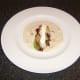 Dill and garlic soured cream is drizzled over the smoked mackerel