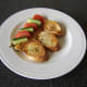 Bruschetta, tomato and cucumber are added to the plate