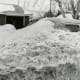 Central Ohio, January 1978. This parked vehicle was covered by large snow plows wor5king the street.