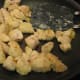 3.Add sauce. As you stir, the pieces will get brown. If they get brown too fast, turn down the heat. When they are all cooked through, pour on the honey (or other sauce) and stir. It will start to bubble and get a bit thick