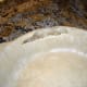 A large tear like this is a disaster with a traditional crust, but this recipe produces a most forgiving dough