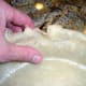 With this crust, just pull down the dough that belongs, and push it all back together