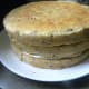 The third layer goes top side up and the rest of the frosting is used.