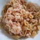Flake the tuna first before adding so as not to break the shells.