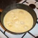Stock and cream is brought to a simmer