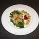 The quail has been casseroled in chicken stock, cream and mushrooms before being served on a bed of braised savoy cabbage.