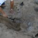 Work slowly and be careful when digging up your turkey. Use a small shovel to remove dirt and coals without puncturing the foil.