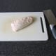 Score the skin of the duck breast in a criss-cross fashion