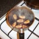 Add plums to reduced wine and stock