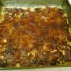 Cover the pressed mixture with the cooked date mixture.
