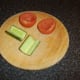 Cucumber and tomato are halved and deseeded