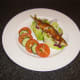 Red pesto sauce is rubbed on to the sardine before it is baked and served with a simple salad.