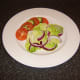 Simple salad accompanies the baked sardine