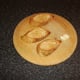 A crushed garlic clove is firstly rubbed over the toasted bread
