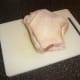 Skin is cut on pork shank