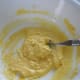 Gradually add flour while stirring. Pictured is with 3 tablespoons of flour added.