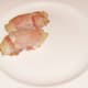 Bacon wrapped partridge breasts are plated