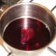 Red wine and whole berry cranberry sauce is reduced