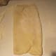 Folding dough in thirds while shaping into loaf.