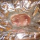 Pork chop ready to be wrapped and baked