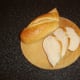 Bread is cut at an angle for bruschetta
