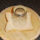 Cutting hole in bread with drinking glass