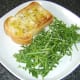 Toast and salad are plated first