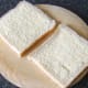 Bread is buttered for toasted sandwich