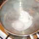 Starting to poach duck egg
