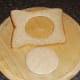 Circle of bread removed from centre of slice