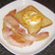 Duck egg bread and bacon are plated first