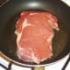Starting to fry rib eye steak
