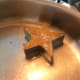 A star-shaped pancake in a mold.