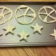 Use triangle cookie cutter or knife to cut out spokes of wheel. We also cut out star shaped biscuits with the scraps of the wheel.