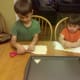Cutting out shapes in the tortillas using cookie cutters.