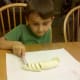 Carefully slice bananas with a knife.